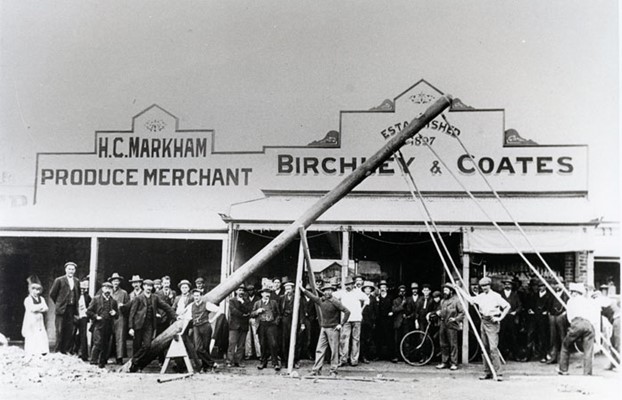 Birchley & Coates Store - Erecting the first light pole outside